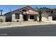 Inviting home with desert landscaping, a tile roof, and a cozy front porch seating area at 7326 W Dreyfus Dr, Peoria, AZ 85381