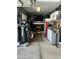 Garage view featuring organized tools, a TV, and an air compressor at 7326 W Dreyfus Dr, Peoria, AZ 85381