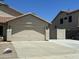 Spacious two-car garage with a concrete driveway and adjacent gated area at 7326 W Dreyfus Dr, Peoria, AZ 85381