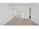 A bright bedroom with neutral carpet and a mirrored closet at 7844 E Rovey Ave, Scottsdale, AZ 85250