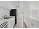 Kitchen with stainless steel appliances, white cabinets and ample counter space at 7844 E Rovey Ave, Scottsdale, AZ 85250