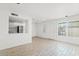 Bright living room featuring wood-look flooring and ample natural light at 7844 E Rovey Ave, Scottsdale, AZ 85250