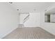 Living room featuring neutral paint, tile flooring and staircase at 7844 E Rovey Ave, Scottsdale, AZ 85250