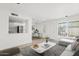 Bright living room featuring wood-look flooring and ample natural light at 7844 E Rovey Ave, Scottsdale, AZ 85250