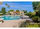 Community pool surrounded by beautiful landscaping at 7844 E Rovey Ave, Scottsdale, AZ 85250