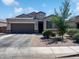 Charming single-Gathering home featuring a two-car garage and well-manicured landscaping at 1237 E Paul Dr, Casa Grande, AZ 85122