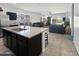 This kitchen flows into the living area with a large island, stainless steel appliances, and ample seating at 1237 E Paul Dr, Casa Grande, AZ 85122