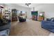 Bright living room with comfy seating, backyard view, and entertainment center at 1237 E Paul Dr, Casa Grande, AZ 85122