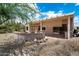 Spacious backyard with patio, mature landscaping, and a serene outdoor retreat at 15313 W Pantano Dr, Surprise, AZ 85374