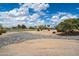 Scenic view of the community golf course featuring desert landscaping and lush green grass at 15313 W Pantano Dr, Surprise, AZ 85374
