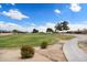Scenic view of the golf course and community, with lush fairways and mature trees at 15313 W Pantano Dr, Surprise, AZ 85374