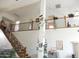 Bright open foyer with staircase, wrought iron railings, high ceilings and views of the second story at 15507 W Marconi Ave, Surprise, AZ 85374