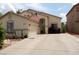 Inviting single-story home with a well-maintained yard, desert landscaping, and neutral stucco exterior at 15507 W Marconi Ave, Surprise, AZ 85374