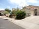 Charming single-story home features desert landscaping, a spacious driveway, and a neutral-toned facade at 15507 W Marconi Ave, Surprise, AZ 85374