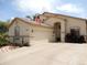 Inviting single-story home with a well-maintained yard, desert landscaping, and neutral stucco exterior at 15507 W Marconi Ave, Surprise, AZ 85374