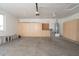 Spacious garage featuring built-in storage cabinets, utility sink, and an abundance of space at 15507 W Marconi Ave, Surprise, AZ 85374