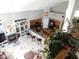 Bright living room with fireplace, TV and adjacent to the kitchen with breakfast bar seating at 15507 W Marconi Ave, Surprise, AZ 85374