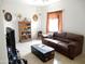 Inviting living room featuring comfortable seating, tile flooring and natural light at 15507 W Marconi Ave, Surprise, AZ 85374