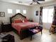 Spacious primary bedroom featuring large windows and a statement bed with unique decor at 15507 W Marconi Ave, Surprise, AZ 85374