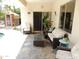 Covered patio features tile flooring, patio furniture, and a view of the cabana and pool at 15507 W Marconi Ave, Surprise, AZ 85374