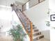 Elegant staircase with decorative tile risers, iron railings, and bright natural light at 15507 W Marconi Ave, Surprise, AZ 85374