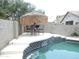Beautiful swimming pool featuring a palapa with seating next to the pool at 15507 W Marconi Ave, Surprise, AZ 85374