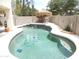 Sparkling pool featuring a palapa with seating, surrounded by a tiled patio and block wall at 15507 W Marconi Ave, Surprise, AZ 85374