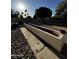 A spacious backyard with rock landscaping and a planter, ready for outdoor enjoyment at 15742 W Central St, Surprise, AZ 85374