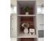 A charming bathroom with decorative shelves and natural wood backings to showcase plants and decor at 15742 W Central St, Surprise, AZ 85374