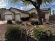 Charming home featuring a two-car garage, desert landscaping with decorative rocks at 15742 W Central St, Surprise, AZ 85374