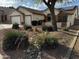 Charming home featuring a two-car garage, desert landscaping with decorative rocks at 15742 W Central St, Surprise, AZ 85374