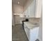 Beautiful kitchen features white cabinets, granite countertops and stainless appliances at 15742 W Central St, Surprise, AZ 85374