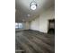Spacious living room with wood floors, vaulted ceilings, recessed lighting, and an entry hall at 15742 W Central St, Surprise, AZ 85374