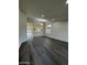 Bright living room featuring wood floors, recessed lighting, and natural light from windows with plantation shutters at 15742 W Central St, Surprise, AZ 85374