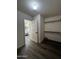 Main closet featuring built in shelving and rod, located next to the bathroom at 15742 W Central St, Surprise, AZ 85374