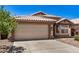 A charming single-story home with a two-car garage, desert landscaping and tile roof at 16120 N 86Th Ln, Peoria, AZ 85382