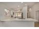 Bright kitchen featuring white cabinets, stainless steel appliances, and a spacious marble countertop island at 16120 N 86Th Ln, Peoria, AZ 85382