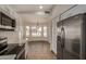 A kitchen that opens up to a bright dining area, complete with modern appliances and ample cabinet space at 16120 N 86Th Ln, Peoria, AZ 85382
