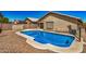 Backyard oasis with sparkling pool, ideal for leisure and outdoor activities in a sunny setting at 16120 N 86Th Ln, Peoria, AZ 85382