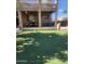 View of artificial grass, a covered patio with furniture, and outdoor decor at 1725 E Coconino Dr, Chandler, AZ 85249