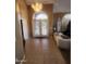 Grand Foyer featuring tile floors, arched doorway, a chandelier, and natural light at 1725 E Coconino Dr, Chandler, AZ 85249