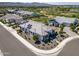 Stunning aerial view of a modern home featuring solar panels, landscaping, and a nearby golf course community at 17376 W Wildwood St, Surprise, AZ 85388
