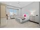 Neutral bedroom with white bedding, shutters, and light wood furniture at 17376 W Wildwood St, Surprise, AZ 85388