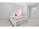 Bright bedroom with white bedding, shutters, and gray walls at 17376 W Wildwood St, Surprise, AZ 85388