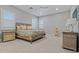 The primary bedroom features a ceiling fan and a comfortable bed with soft textures at 17376 W Wildwood St, Surprise, AZ 85388