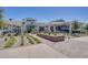 Beautiful clubhouse with outdoor patio, manicured landscaping, and ample seating at 17376 W Wildwood St, Surprise, AZ 85388