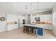Open kitchen featuring an island with seating and modern appliances at 17376 W Wildwood St, Surprise, AZ 85388