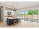 Spacious kitchen with a large island, stainless steel appliances, and access to the patio at 17376 W Wildwood St, Surprise, AZ 85388