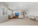 Airy living area features hardwood floors, neutral walls, vaulted ceiling, plantation shutters, and recessed lighting at 17376 W Wildwood St, Surprise, AZ 85388
