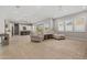 Open-concept living space with hardwood floors, neutral walls, recessed lighting, and an adjacent modern kitchen at 17376 W Wildwood St, Surprise, AZ 85388
